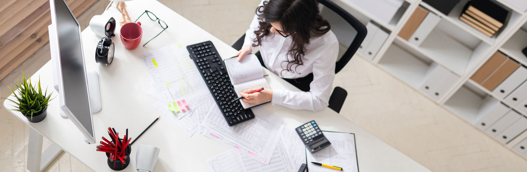 Woman working at desk.